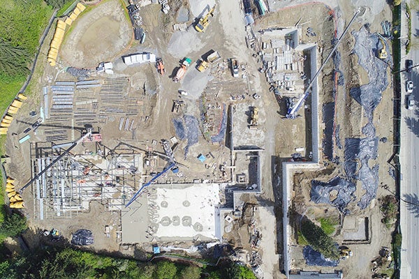 Aerial view of a large construction site with equipment