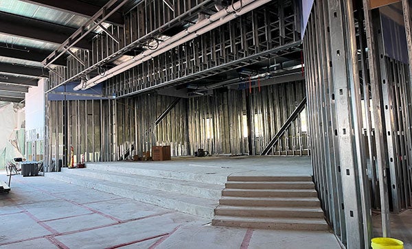 metal framing around a concrete platform with stairs
