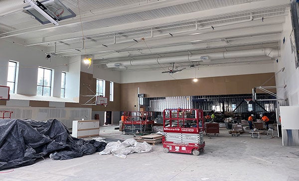 a large volume room with high ceilings under construction