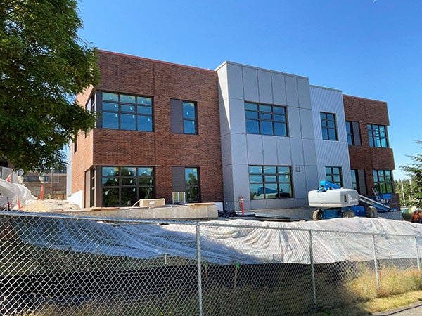 exterior of a two story brick and metal clad building