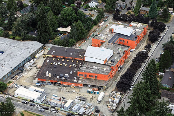 aerial of a building udner construction with another large building next to it