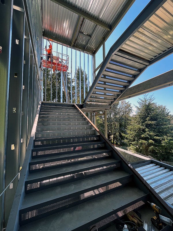 steel stair frames on the outside of a building under construction