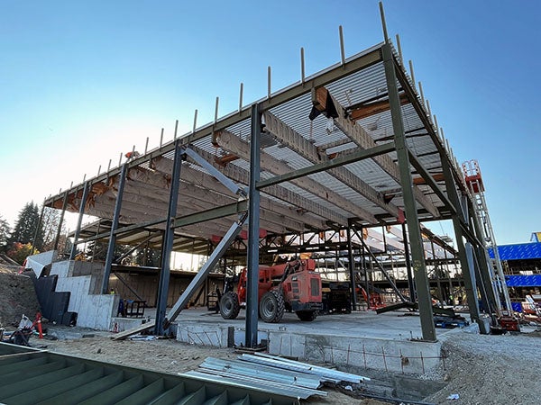 a two story high steel frame has metal decking on top