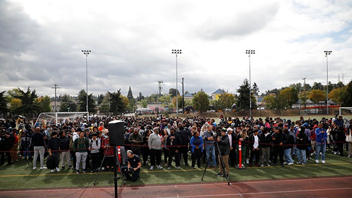 a large group of people gathered on a field