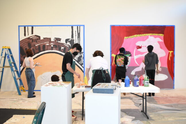 Group of high school students painting