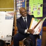 Superintendent Jones read a book to students in a classroom