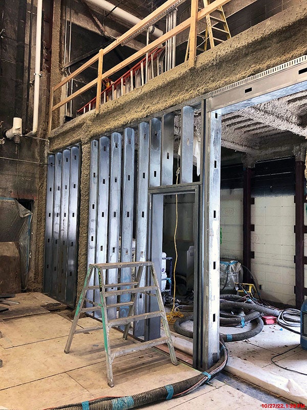 metal framing below a balcony under construction