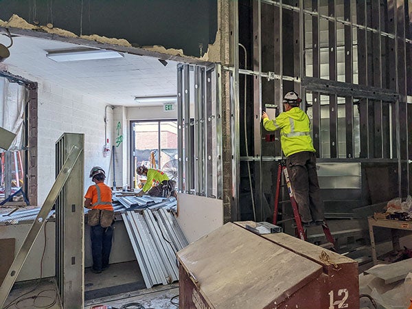 workers in a room under construction