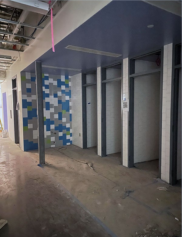 small rooms with no doors have a tile wall next to them