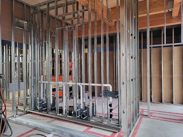 interior of a building under construction with metal framing