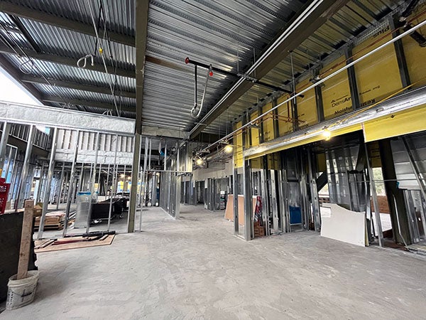 interior of a building under construction with metal framing and metal ceiling