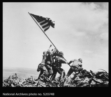 photo of soldiers raising the American Flag at Iwo Jima