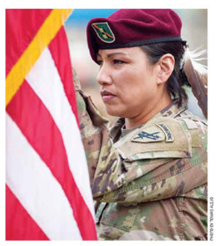 photo of Misty Lakota holding an American Flag