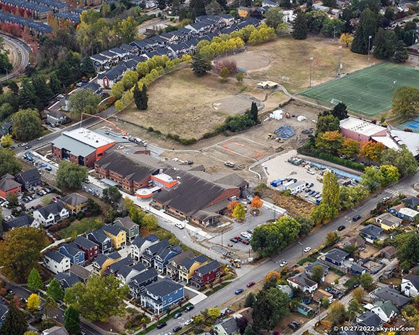aerial photo at an angle to a large building with constructon happening