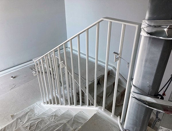 a staircase with plastic sheeting on the steps