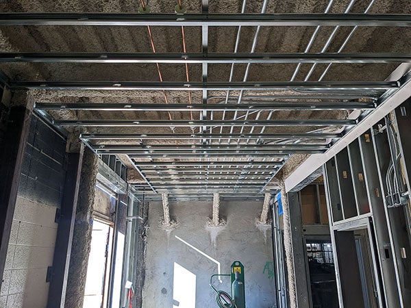 meal wall and ceiling framing with wood above the ceiling framing