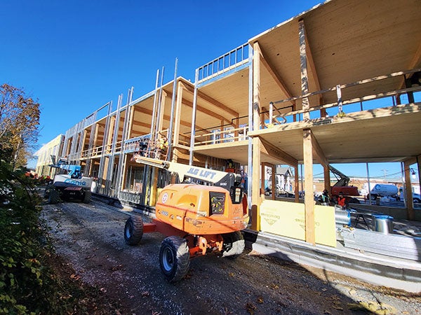 a 2 story building under construction with no walls