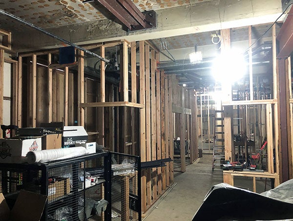 wood framing in an old building with new metal beams