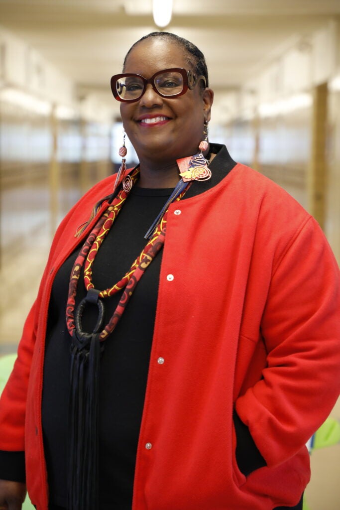 Tonja Davis poses for a photo in a school hallway