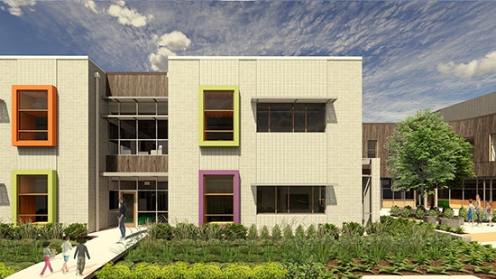 part of a large two-story building with bright colored window frames