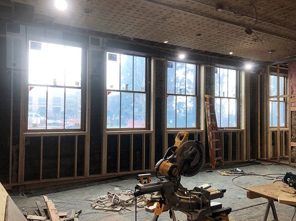 a room unfinished has windows in wood framed walls