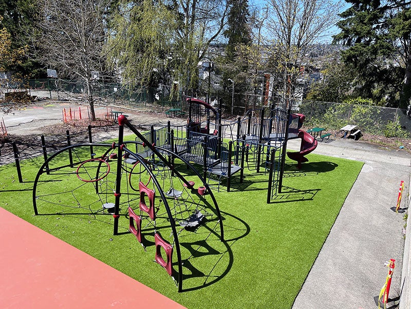 outdoor play structures site on artificial turf