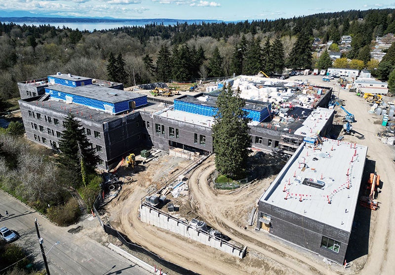 aerial view of a multi story building with construction work going on