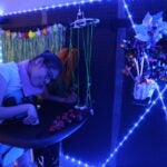 Student plays with sensory wall.