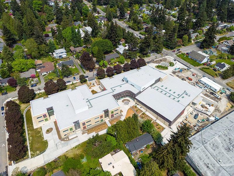 aerial view of a large building with a courtyard - another large building is in the lower right corner