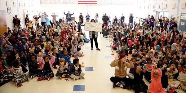 Principal Pamela McCowan-Conyers at West Seattle Elementary holding the check from The Alliance for Education