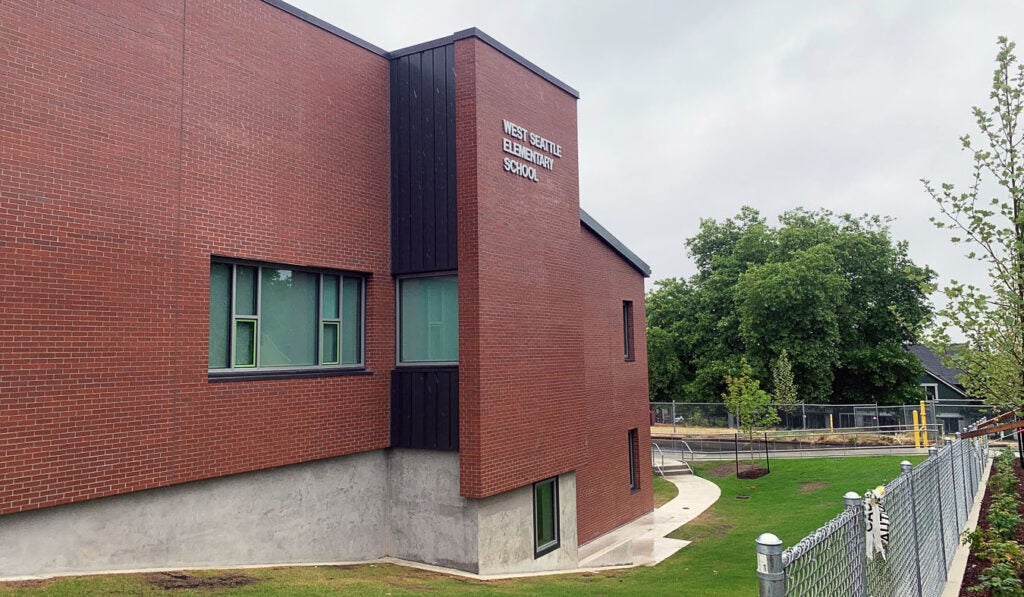 a brick building has a sign that says West Seattle Elementary School