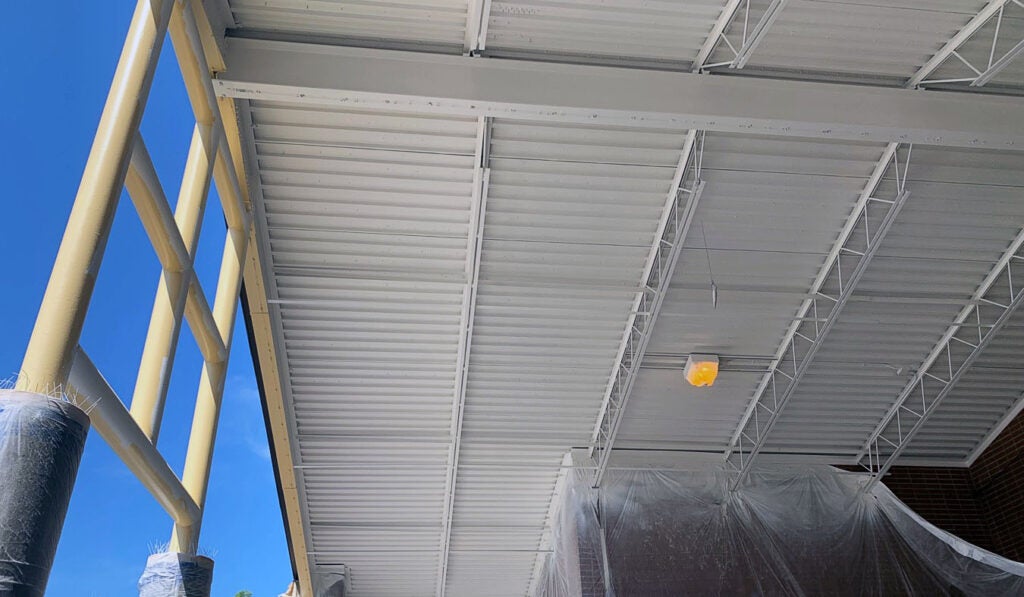 looking up at the underside of a roof over a play area