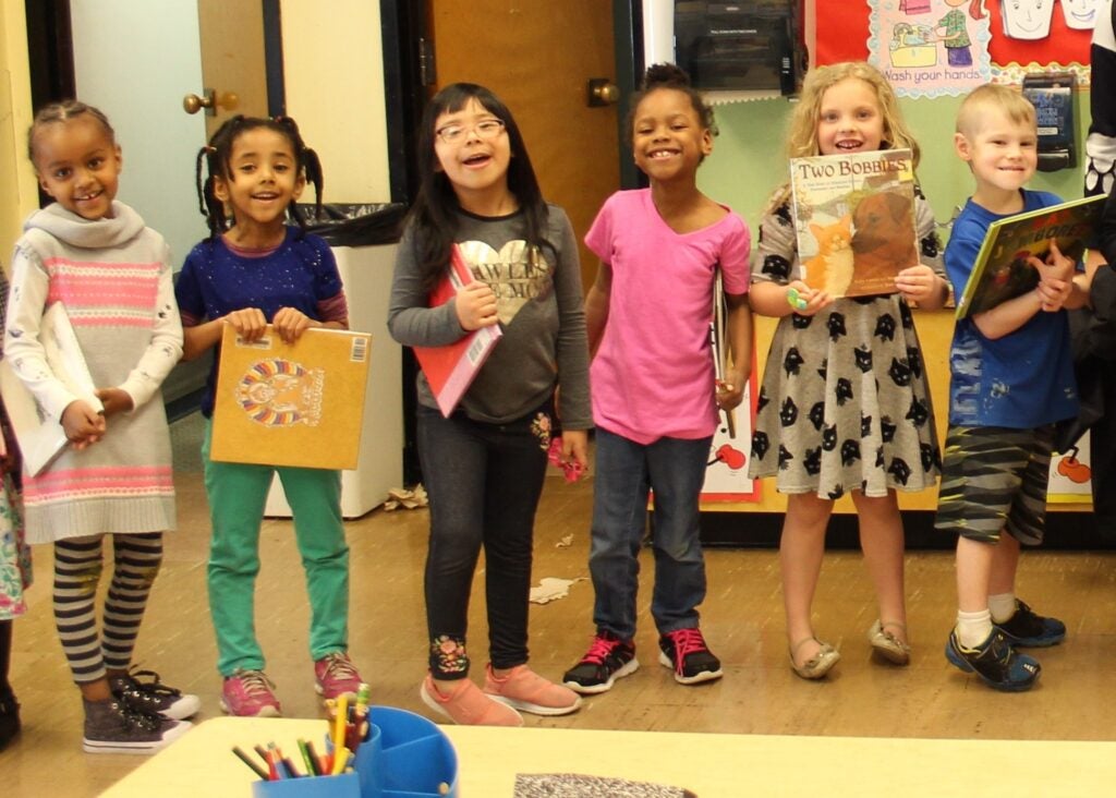 Kindergarteners waiting to visit the school library. 