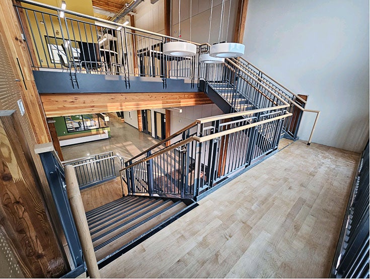 a stairway landing with stairs up to second floor and down to first floor
