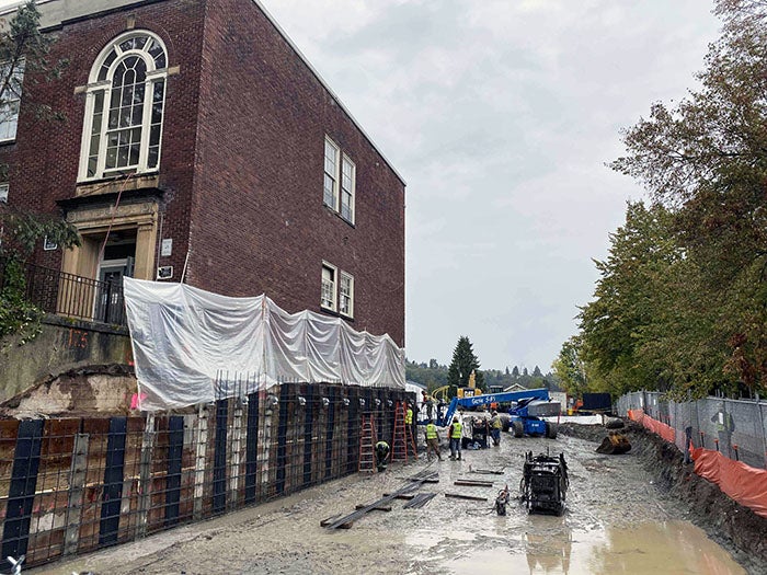 a brick building with construction in progress on the outside