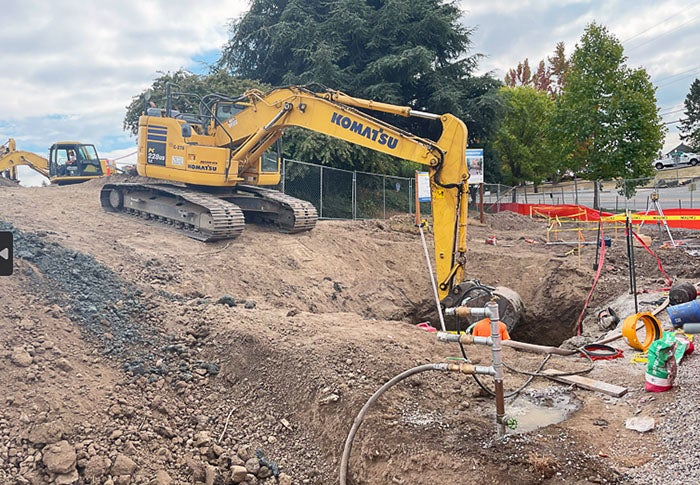 an excavator digging a hole