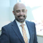 Dr. Rocky Torres smiles for a photo