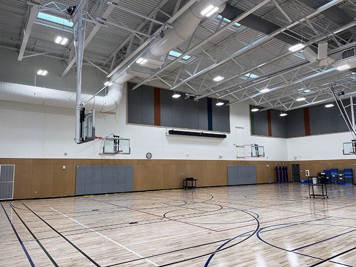a gym with basketball hoops