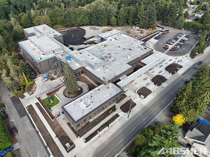 aerial view of a large building with trees