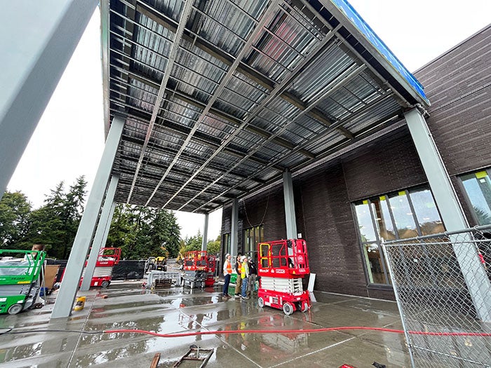 a building under construction with workers