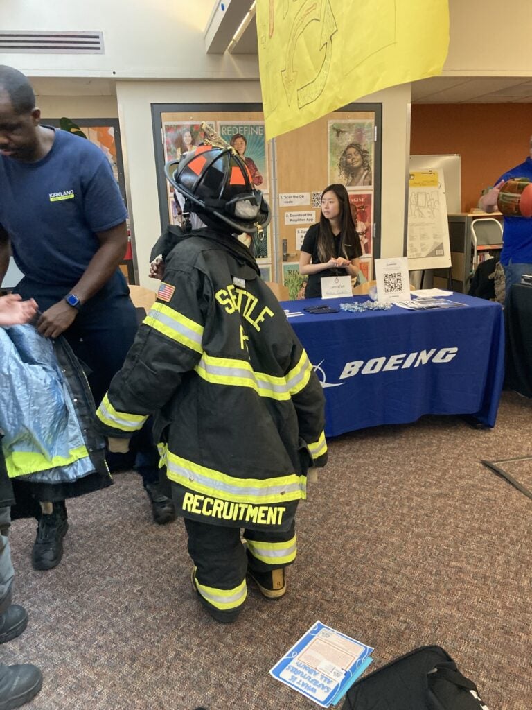 students tried on firefighting equipment