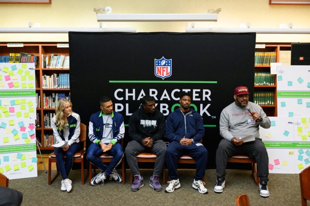 Panel of Seahawks players, dancers, and announcers