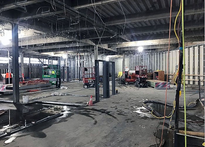 inside a large building under construction with no walls yet