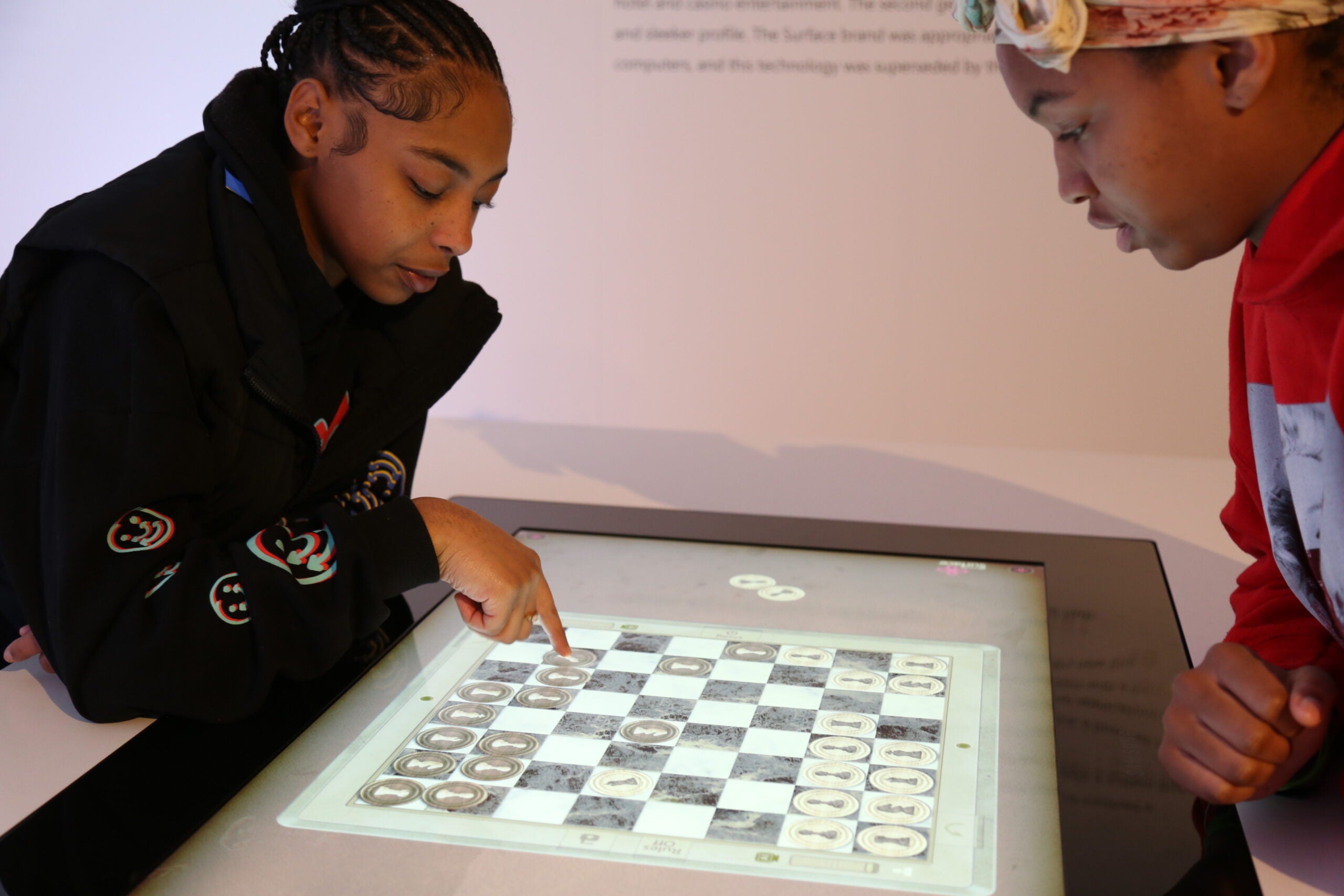 Two AAMA students play electronic chess.