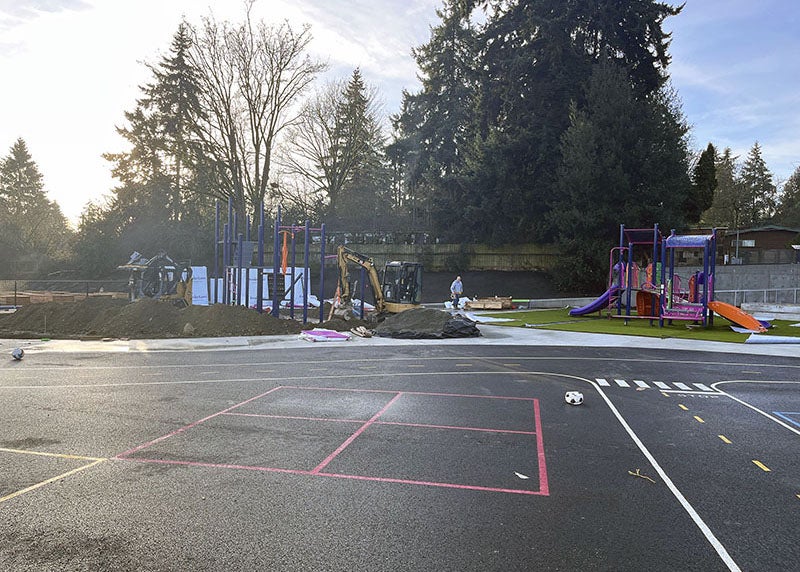 a paved area with striping painted on it