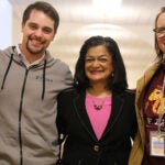 Pramila Jayapal and BF Day staff stand next to each other, smile at camera