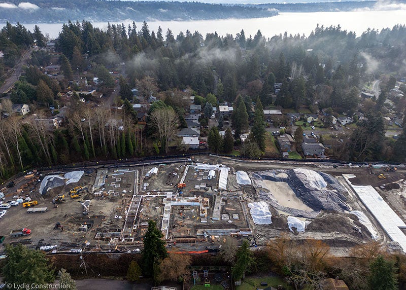 aerial of part of a large construction site with concrete footings showing where the building will be