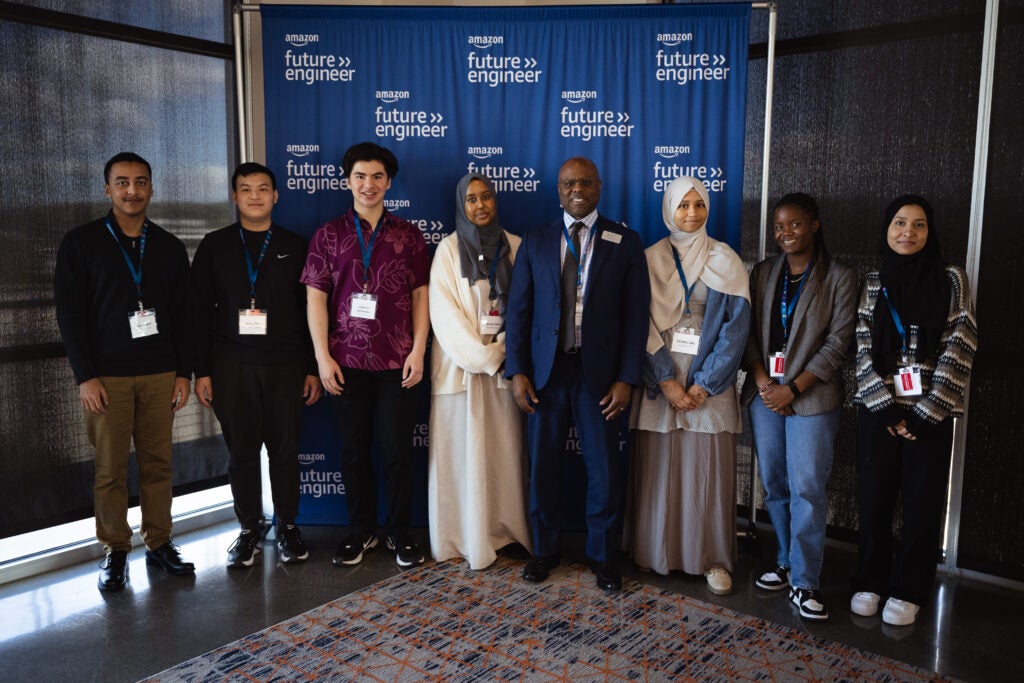 Group of students who won the Amazon Future Engineer Scholarship smile at camera. 