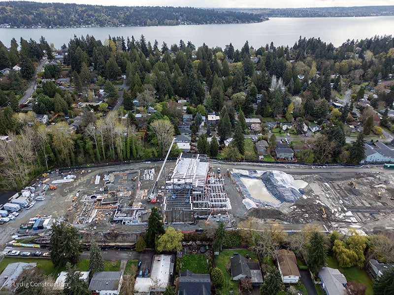 aerial of a building under construction with foundations for other parts surrounding it