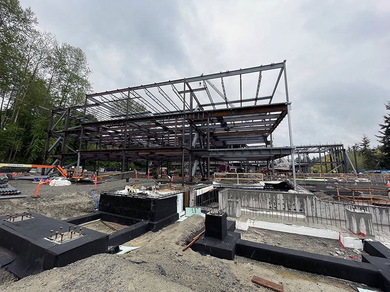 steel framing for a large building and some ground work in front of it
